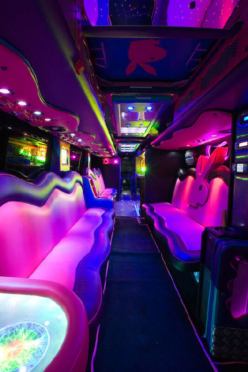 Chauffeur driven Party Bus limousine hire Play Boy den interior in Bristol, Gloucester, Cheltenham, Cardiff, Wales, Weston Super Mare, and Bath.