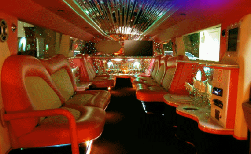 Chauffeur stretched pink Hummer H2 limo hire interior in London, Surrey, Kent, Essex, Berkshire, Hampshire, Buckinghamshire, Hertfordshire, Oxfordshire, Cambridgeshire, and Wiltshire.
