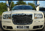 Chauffeur stretched cream Chrysler C300 Baby Bentley limo hire with Lamborghini doors in Birmingham, Dudley, Wolverhampton, Telford, Walsall, Stafford, Worcester